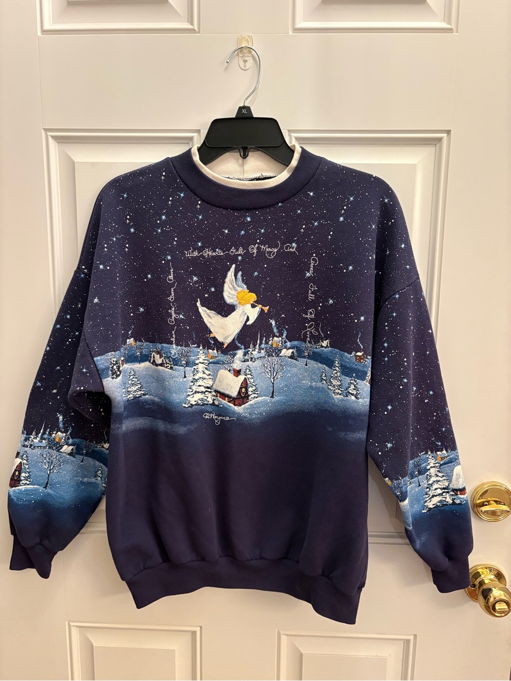 Vintage D. Morgan Women’s Navy painted Blue Angel Holiday Crewneck Sweatshirt.